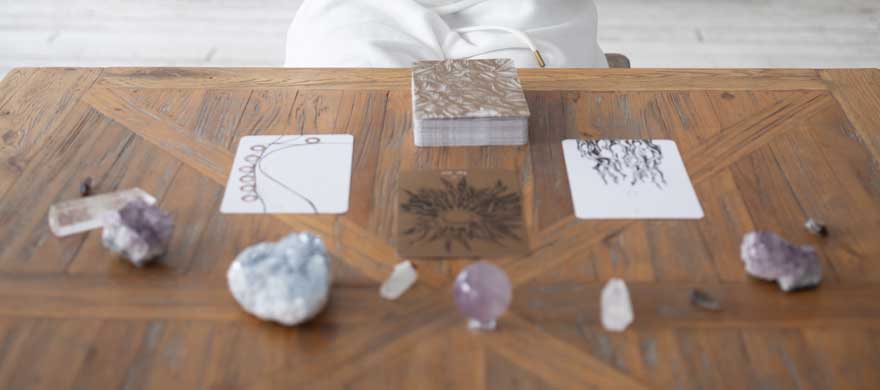 tarot cards with crystal energy around